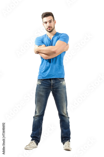 Man with wrapped arms posing at camera © sharplaninac