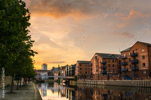 Redeveloped Warehouses along the River in Leeds at Sunset photo