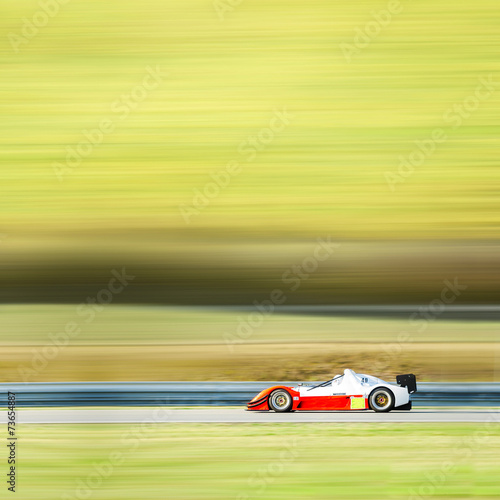 formula one race car on speed track - motion blur background