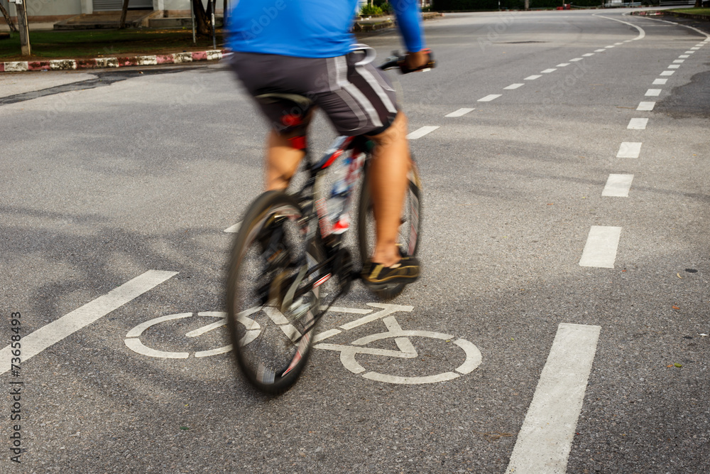 Bicycle sign or icon and movement of cyclist in the park Bicycle sign or icon and movement of cyclist in the park