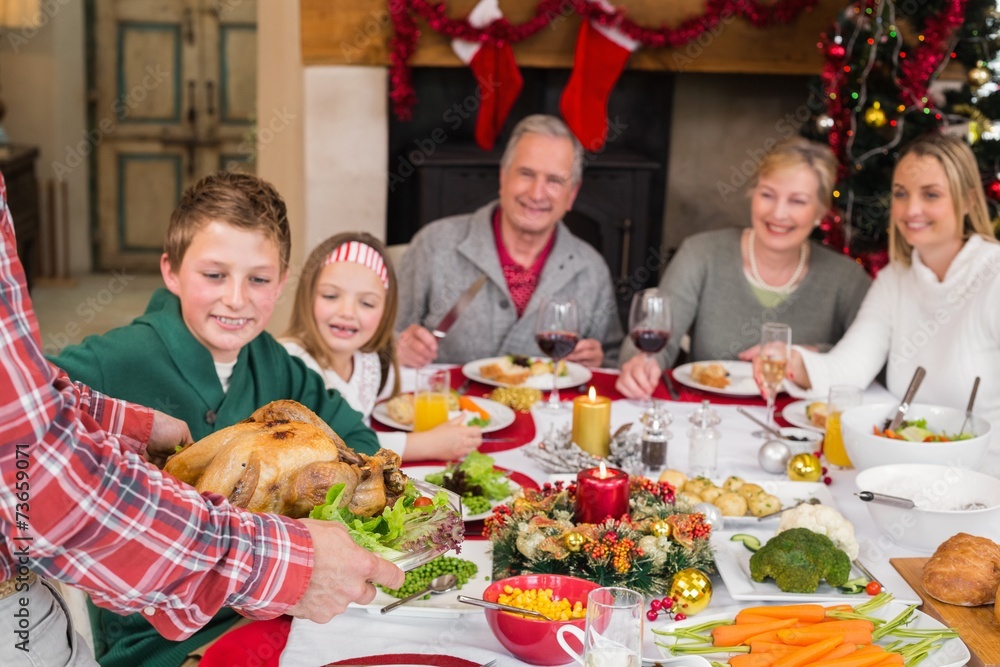 Man serving roast turkey at christmas Man serving roast turkey at christmas