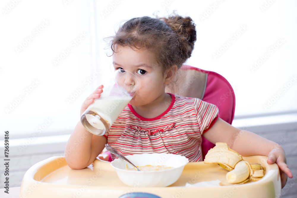 Pretty kid drinking milk from glass Pretty kid drinking milk from glass