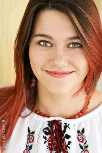 Beautiful Ukrainian girl in traditional embroidered shirt