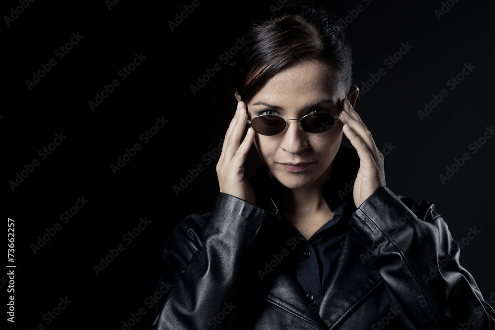 Attractive female agent in black leather coat Attractive female agent in black leather coat