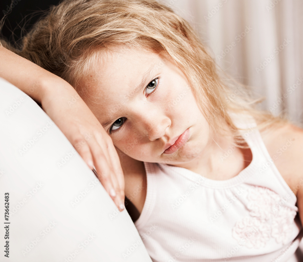 Fototapeta premium Sad little girl at home