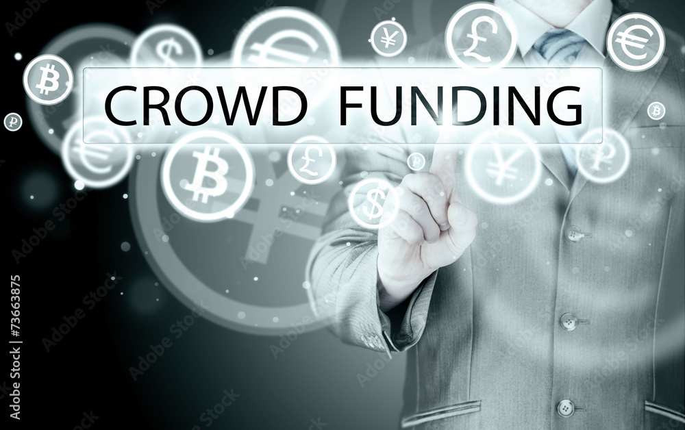 Businessman pushes virtual crowd funding button Businessman pushes virtual crowd funding button