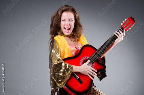 Guitar player with red instrument