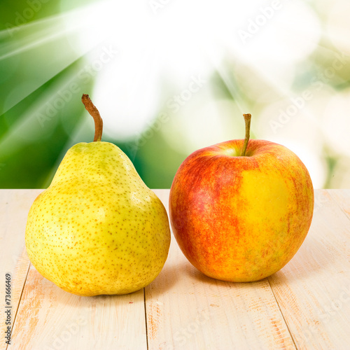 pears and apples against the sun