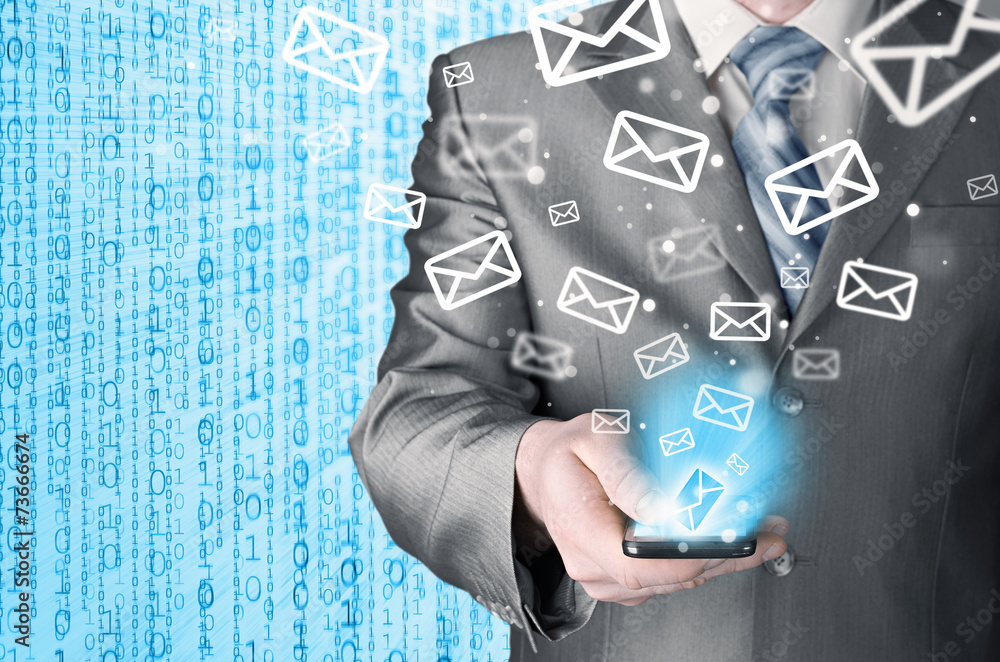 Business man holding smart phone and sending emails Business man holding smart phone and sending emails