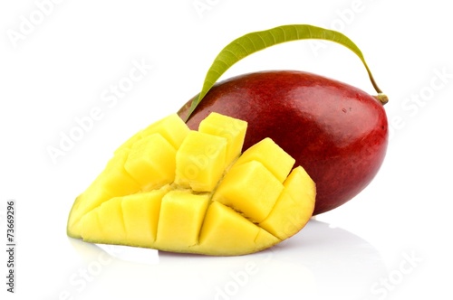Ripe mango with slice and leaf isolated white background