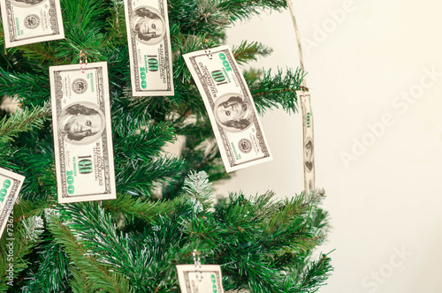 Christmas tree decorated with dollars notes
