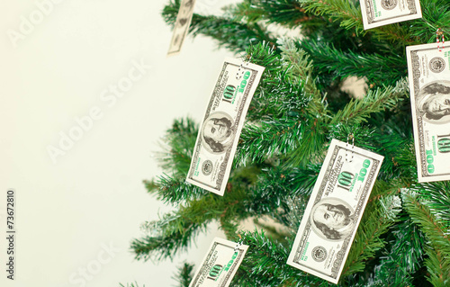 Christmas tree decorated with dollars notes