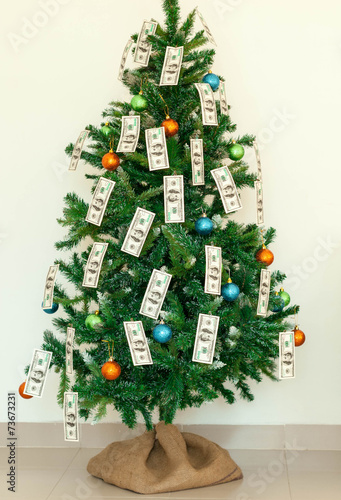 Christmas tree decorated with dollars notes