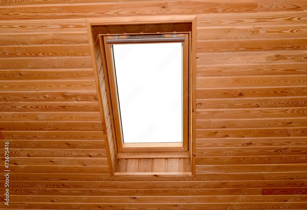 Window on a penthouse of the wooden house Window on a penthouse of the wooden house