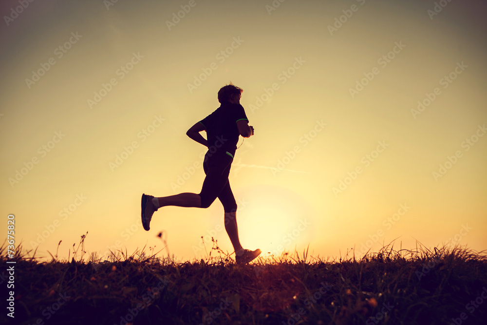 Running man silhouette in sunset time Running man silhouette in sunset time