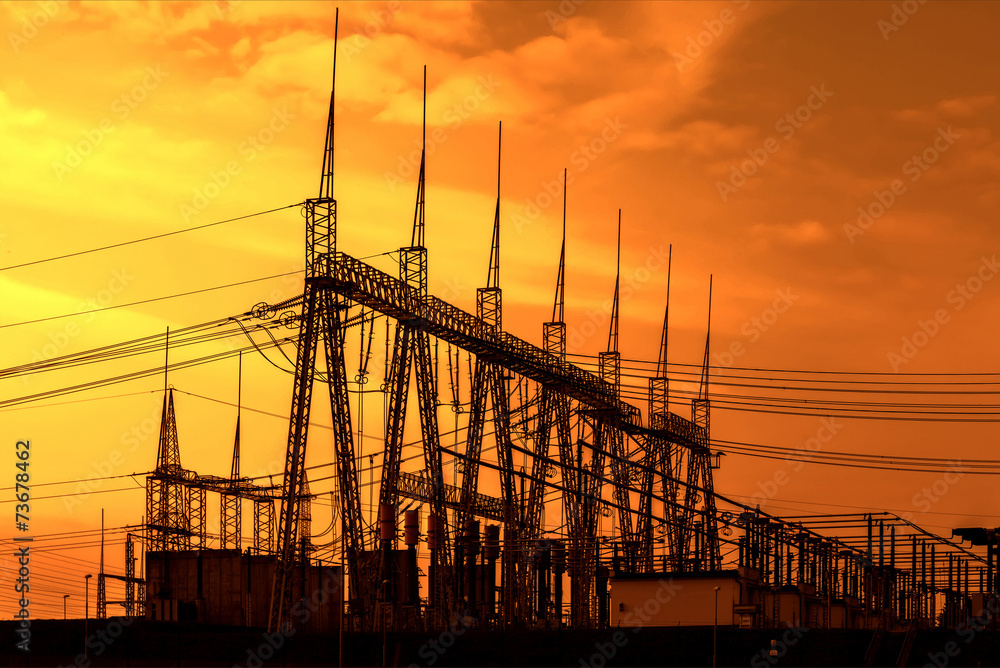 High voltage power transformer substation, sunset