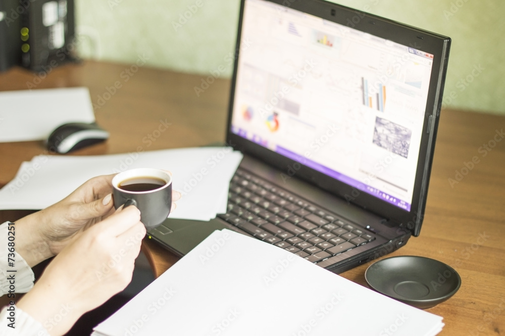 The process of with a laptop and documents The process of with a laptop and documents
