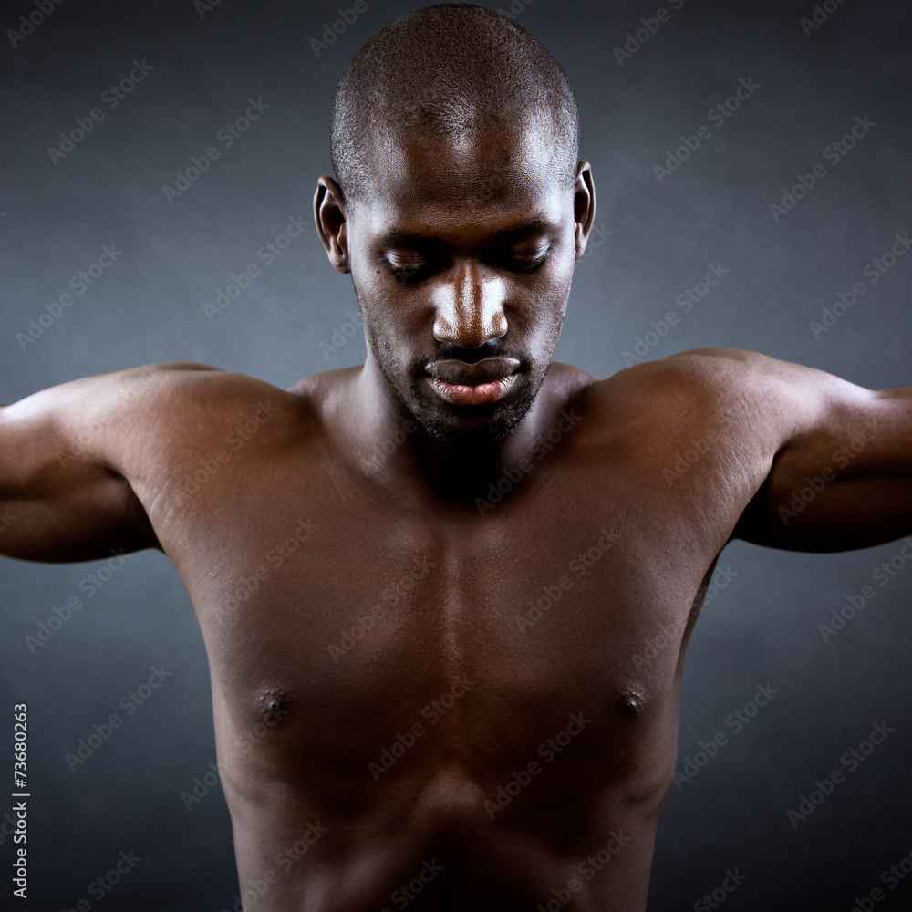 Fototapeta premium Muscular man with his arms outstretched. Freedom concept.