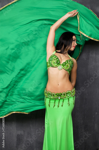 Young pretty woman in green indian dress