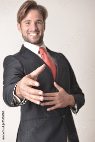 Businessman offering a handshake photo