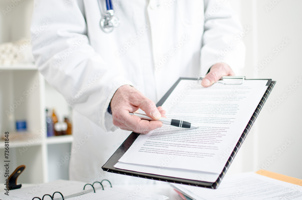Doctor showing notes Doctor showing notes