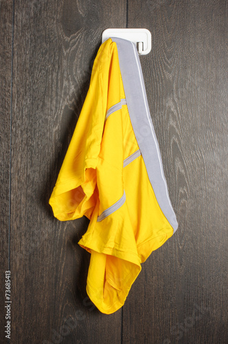 Fotografia Messy yellow man underwear hanged on the wall