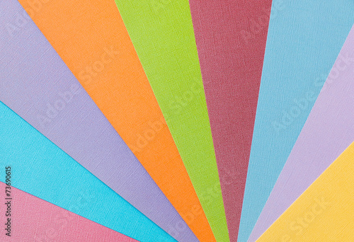 Colorful pattern made from textured paper sheets.