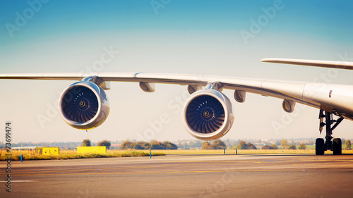 View on wing with two jet engines of Airbus A380 photo