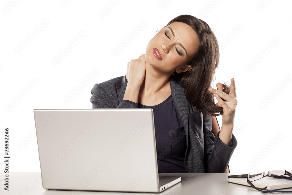 young beautiful businesswoman has a pain in the neck young beautiful businesswoman has a pain in the neck