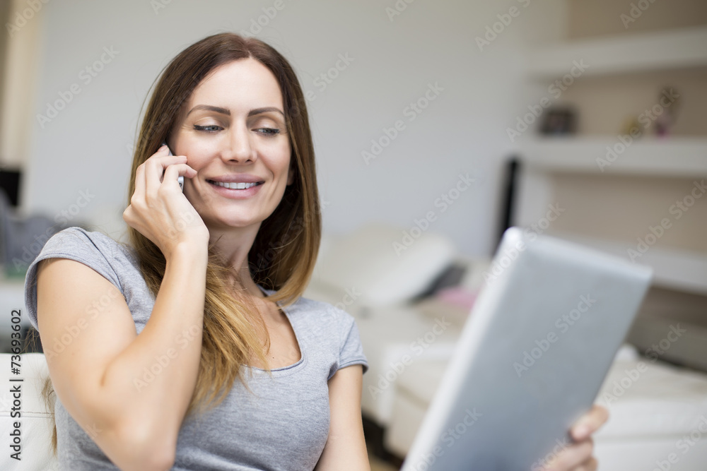 Young woman with tablet at home