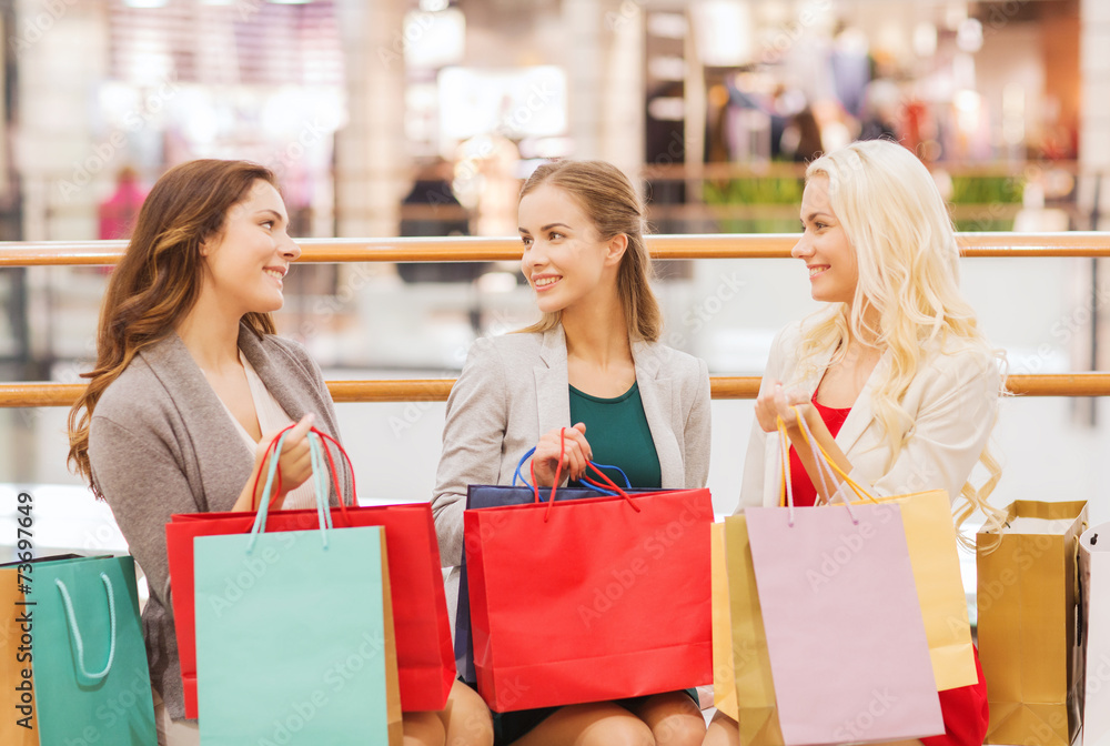 happy young women with shopping bags in mall happy young women with shopping bags in mall
