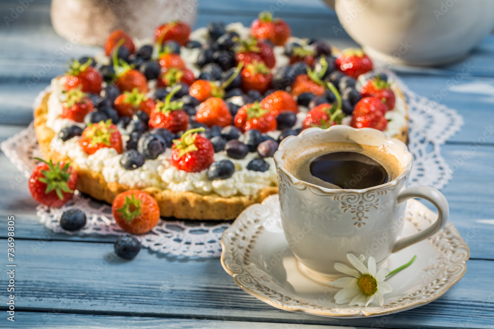 Coffee and fruit tarts served in the garden Coffee and fruit tarts served in the garden