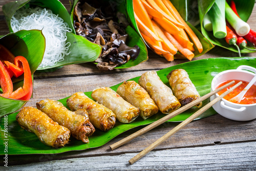 Fried spring rolls surround...