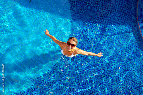 Beautiful woman in the pool.