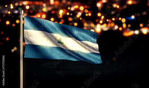 Tableau sur toile Nicaragua National Flag City Light Night Bokeh Background 3D