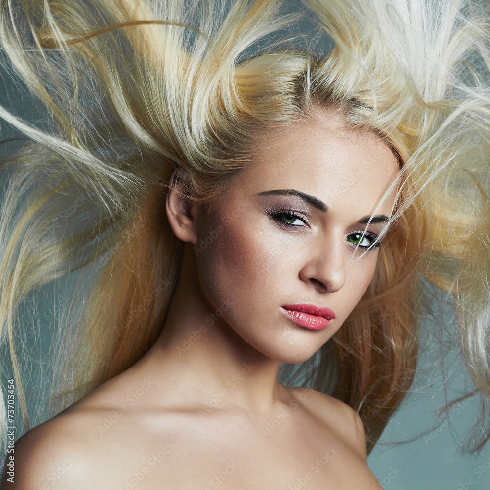 beautiful young woman with long hair.Blond girl.Beauty salon beautiful young woman with long hair.Blond girl.Beauty salon