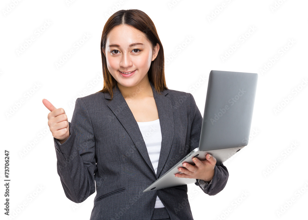 Asian businesswoman with laptop and thumb up Asian businesswoman with laptop and thumb up