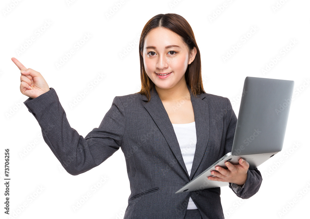 Asian businesswoman with laptop and finger point up Asian businesswoman with laptop and finger point up