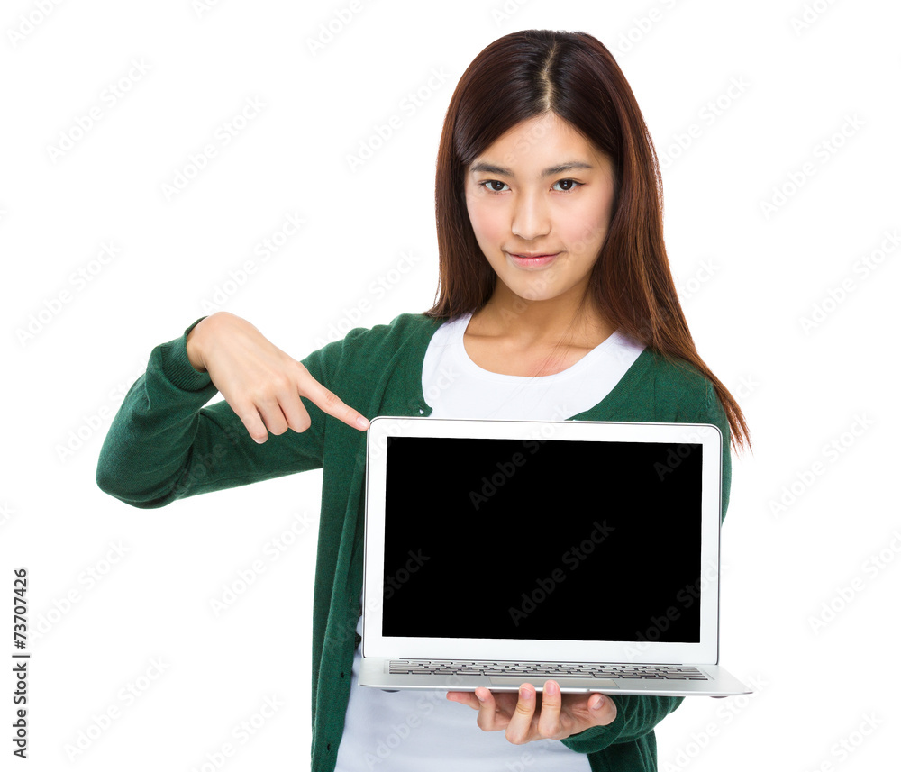 Woman finger point down to the blank screen of computer Woman finger point down to the blank screen of computer