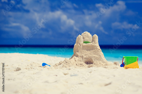 Sand castle on tropical beach