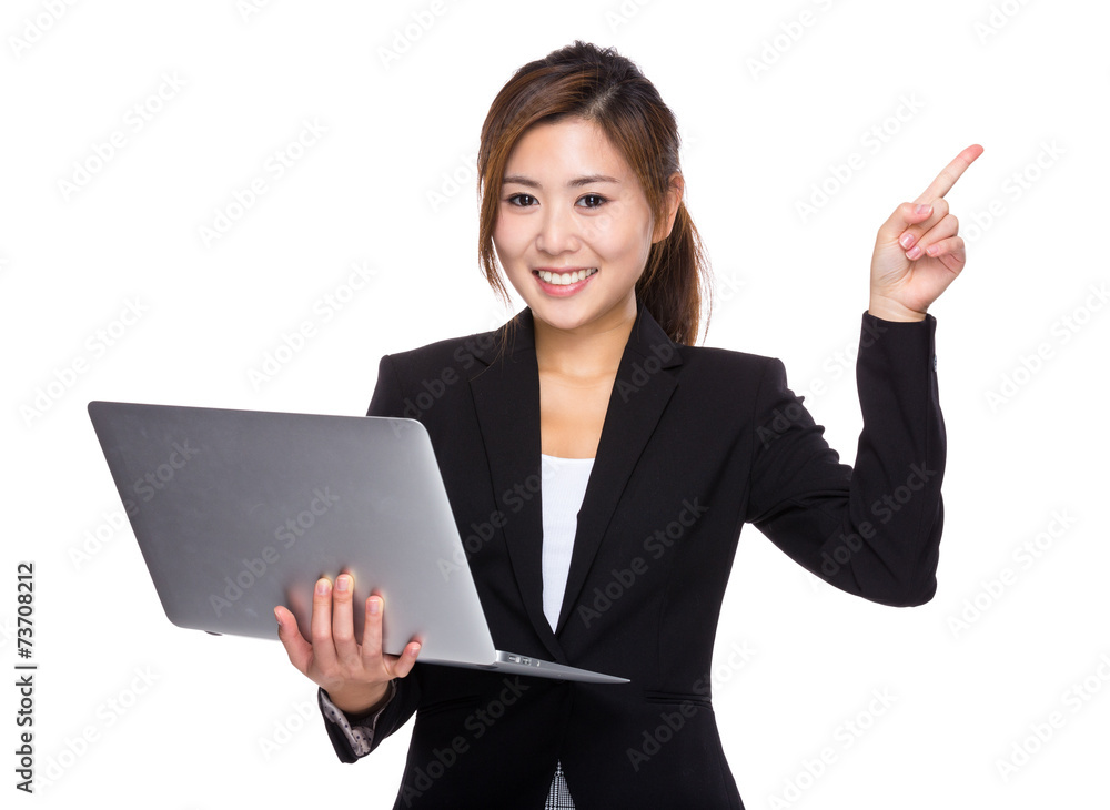 Businesswoman use of laptop and finger up Businesswoman use of laptop and finger up