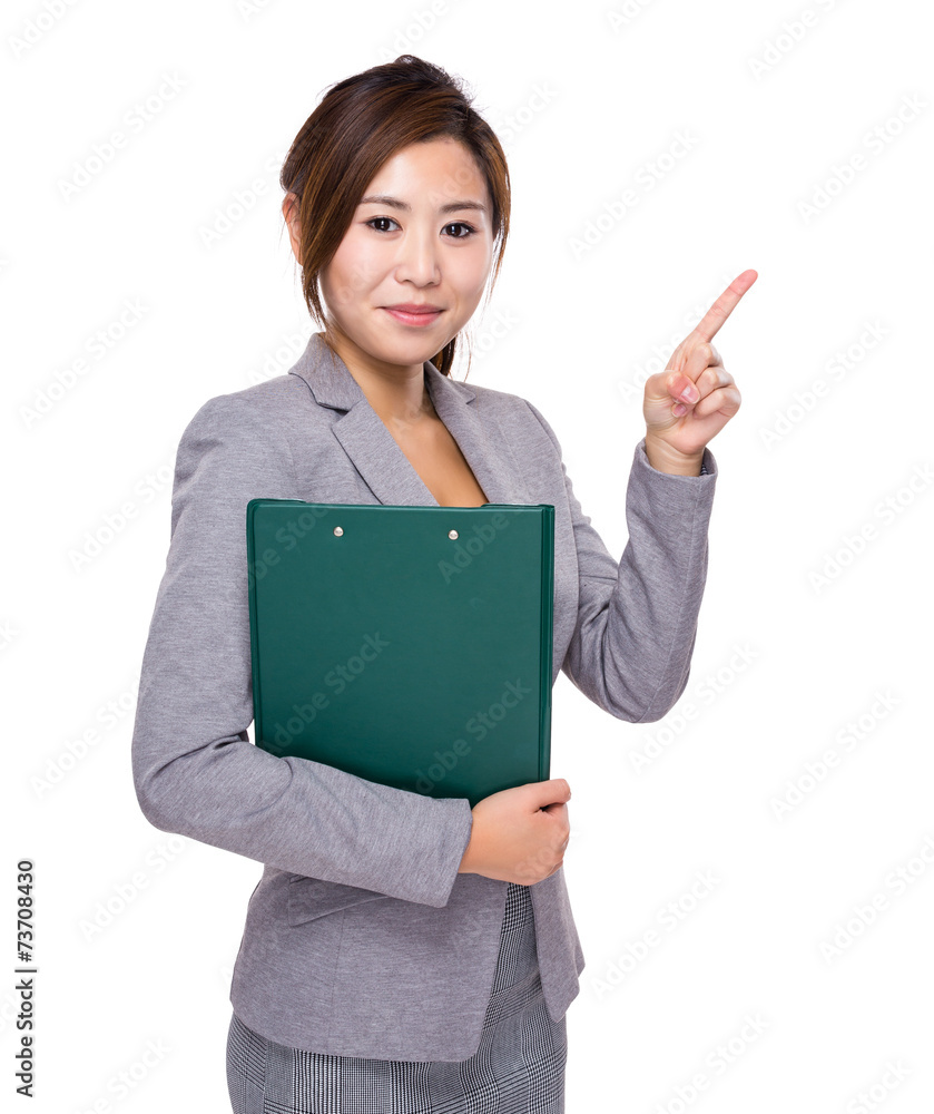Asian businesswoman with clipboard and finger point up Asian businesswoman with clipboard and finger point up