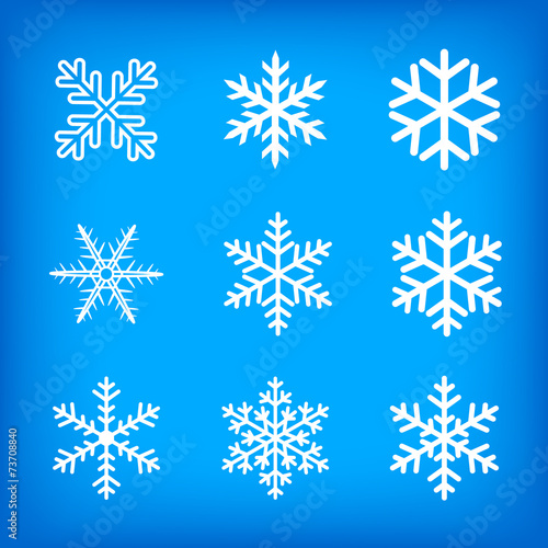 white snowflakes on blue background