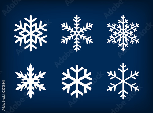 white snowflakes on dark blue background