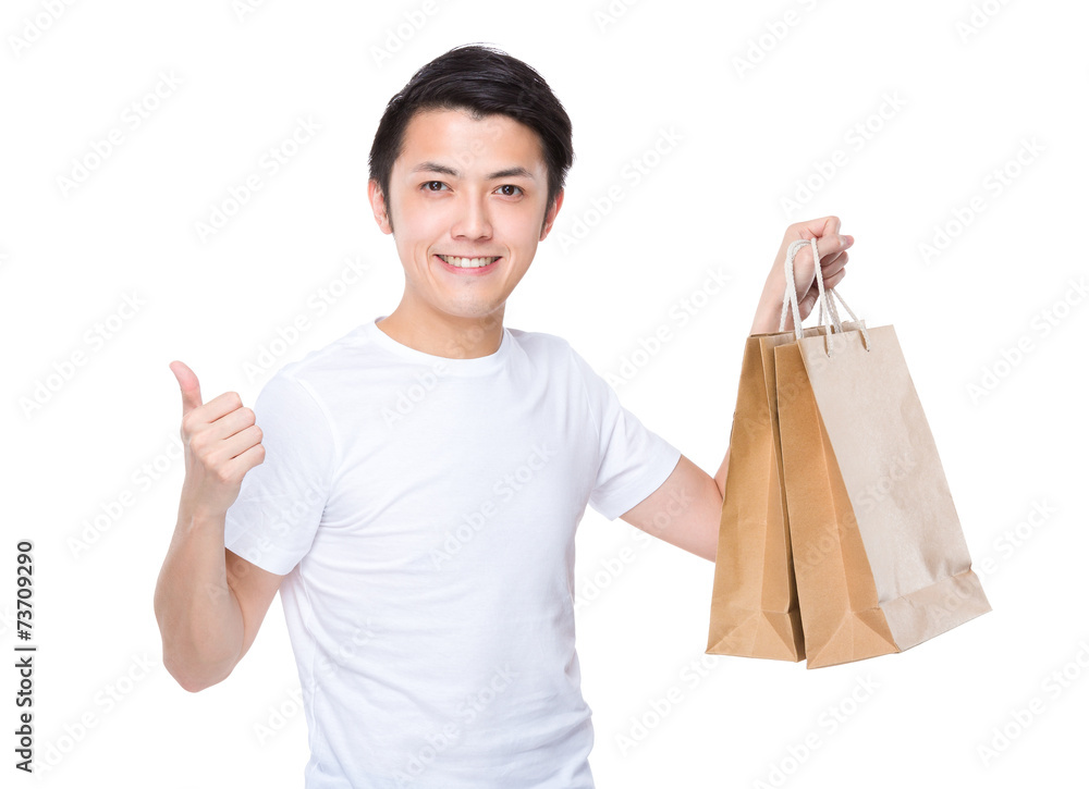 Man with shopping bag and thumb up Man with shopping bag and thumb up
