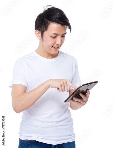 Man look at tablet © leungchopan