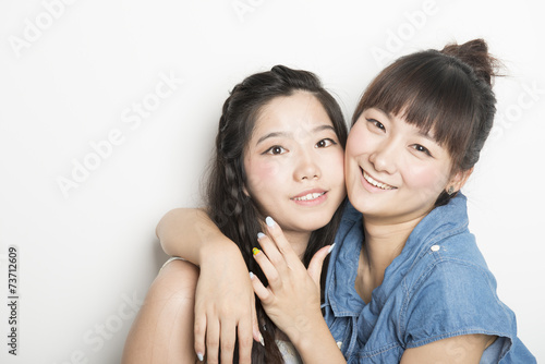 Two smiling asian girls