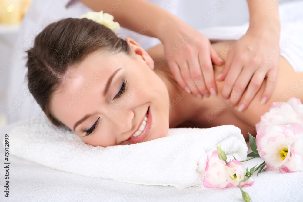 Beautiful young woman having massage in spa salon Beautiful young woman having massage in spa salon