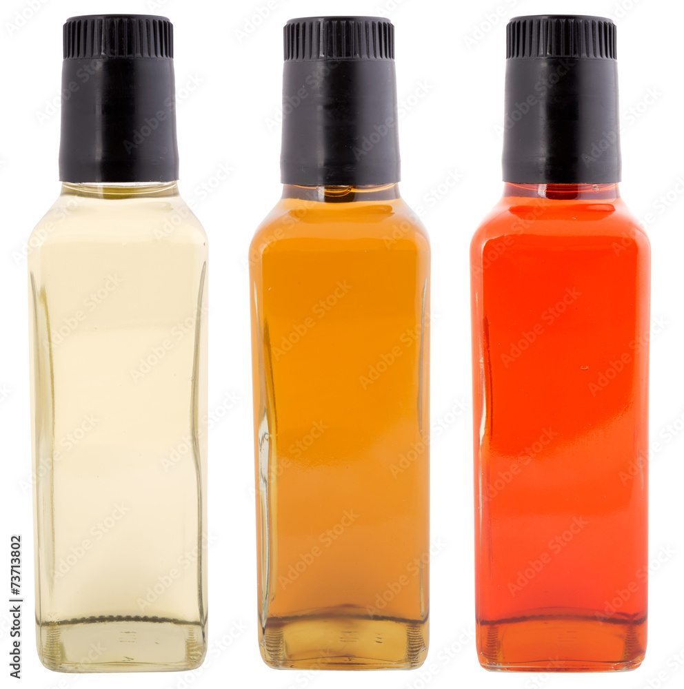 three bottles of vinegar ready for labeling isolated three bottles of vinegar ready for labeling isolated