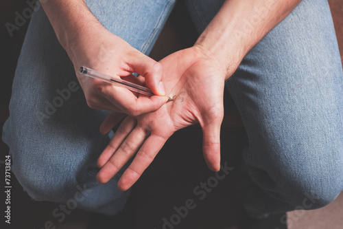Man writing on his hand